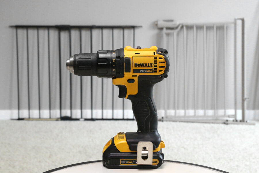 power drill in front of pet gates