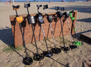 group of metal detectors on the beach