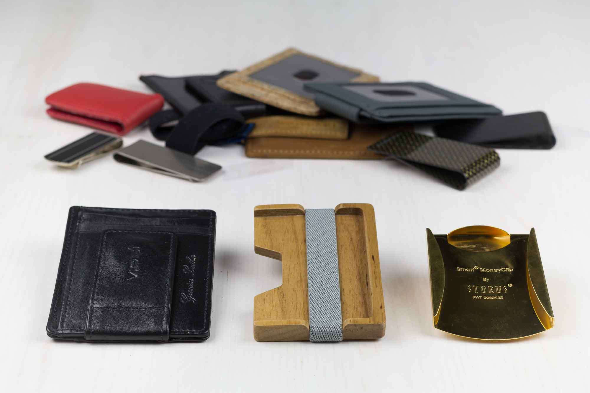 pile of money clips and wallets
