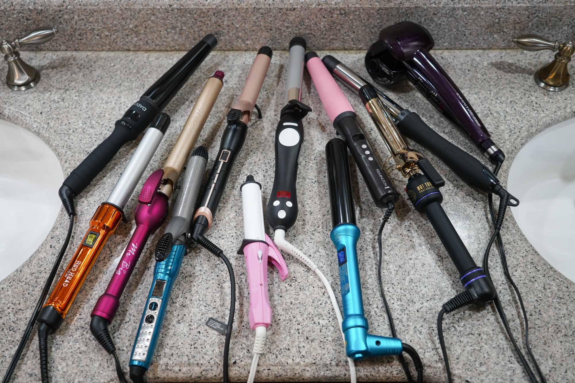 Assorted curling irons on countertop