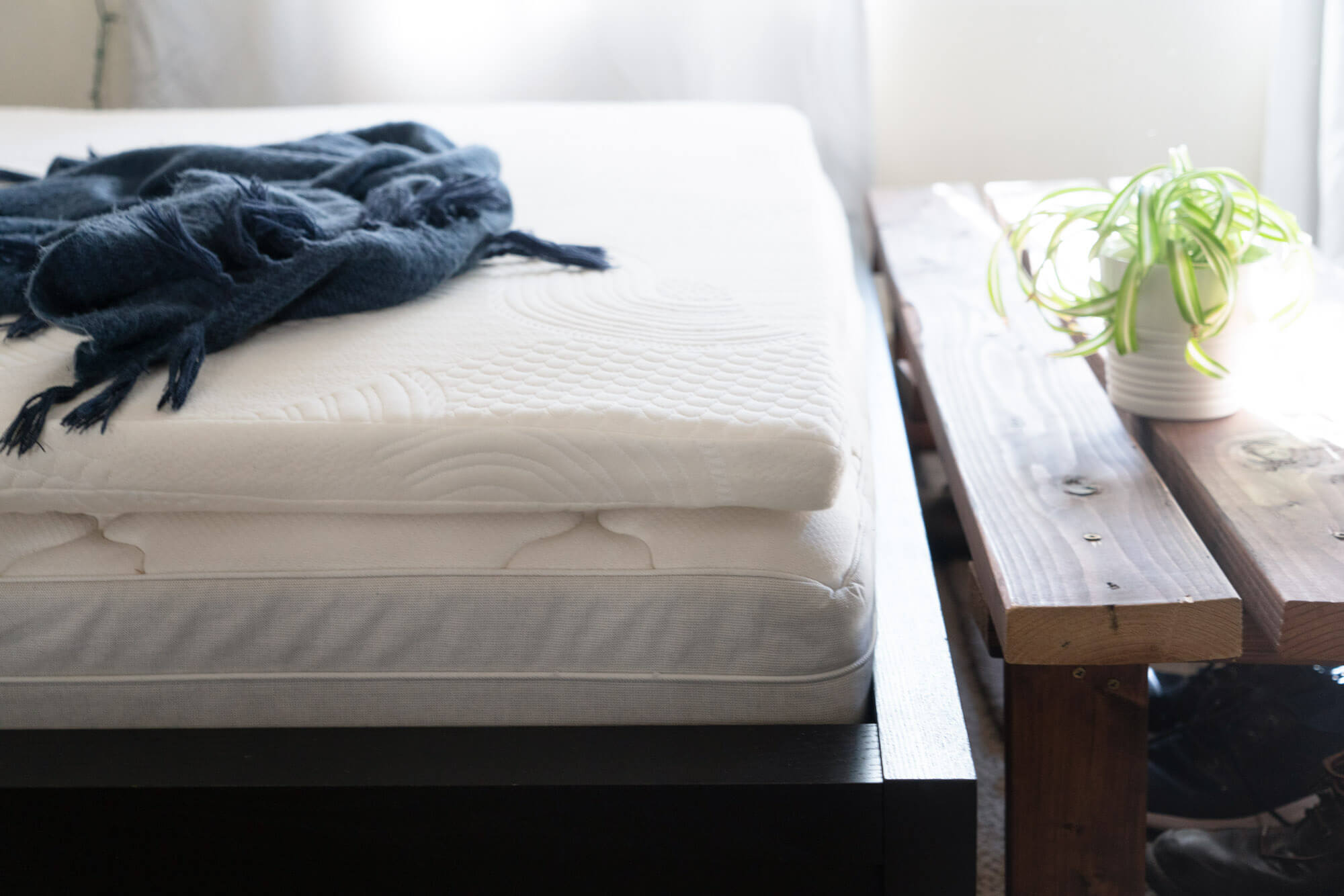 Organic Textiles mattress topper placed on bed