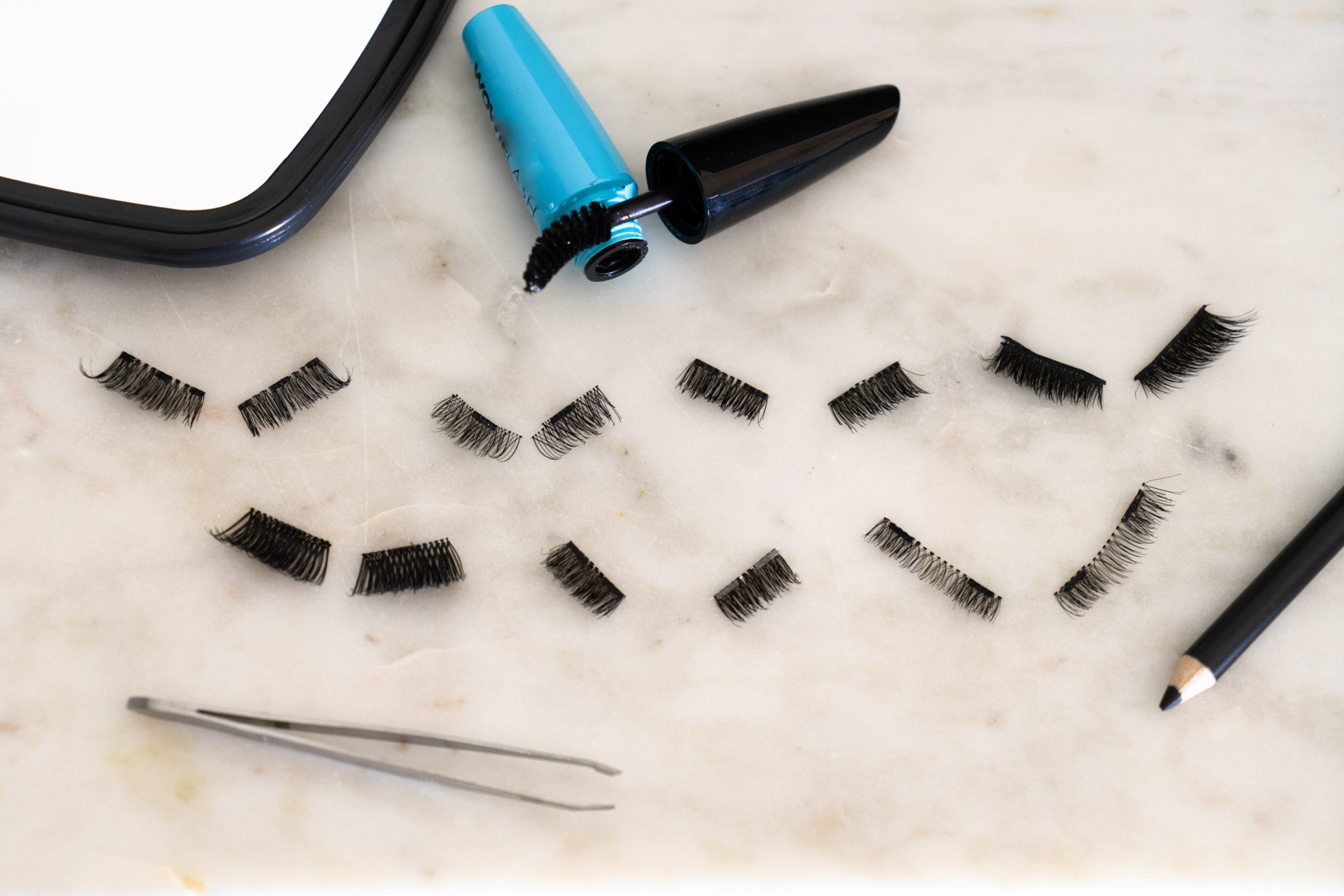 Group of magnetic eyelashes on a countertop