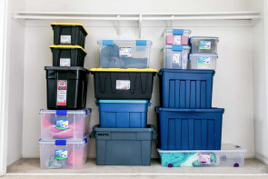 Containers stacked in a closet