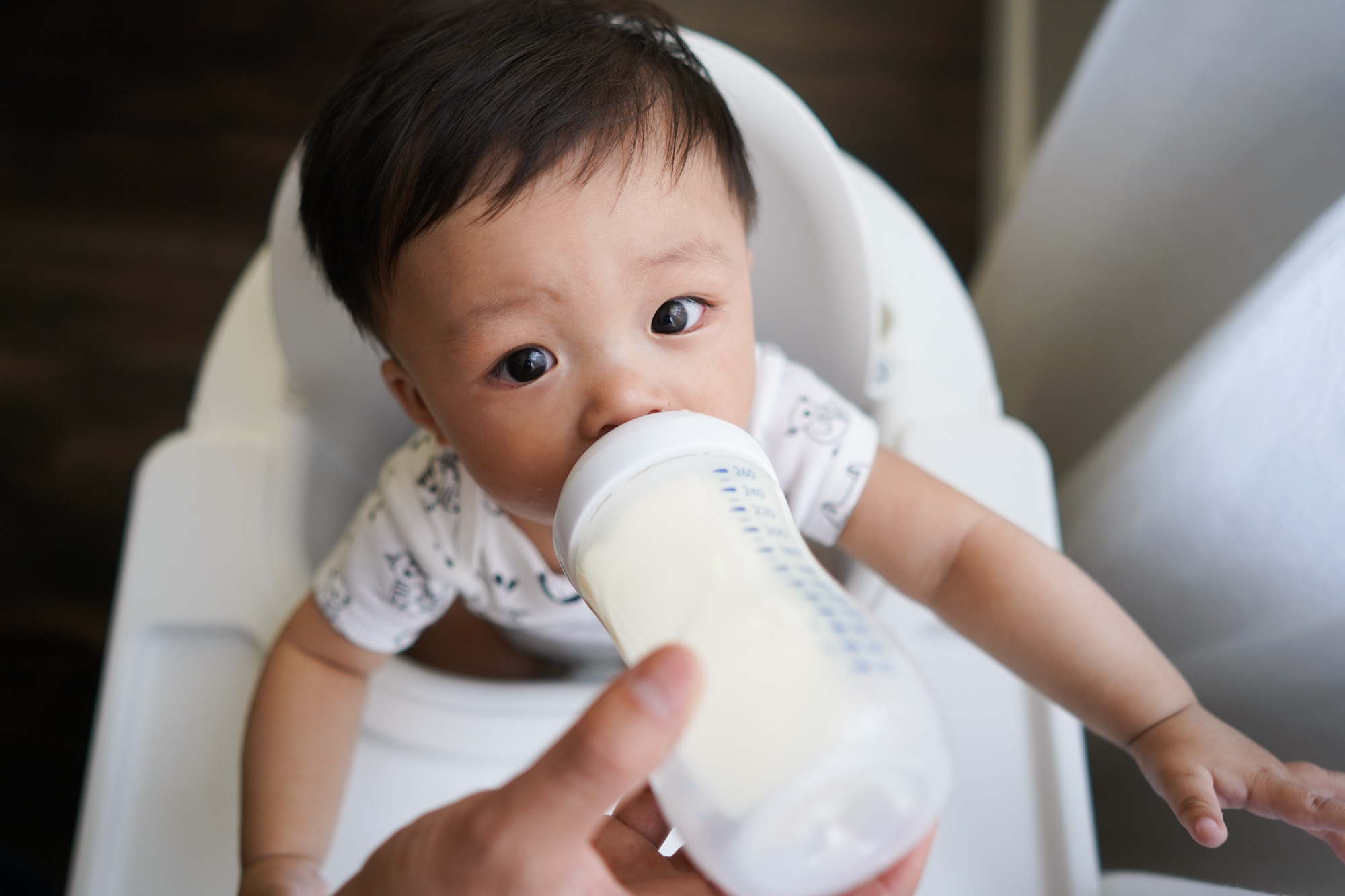 A baby drinking from a bottle