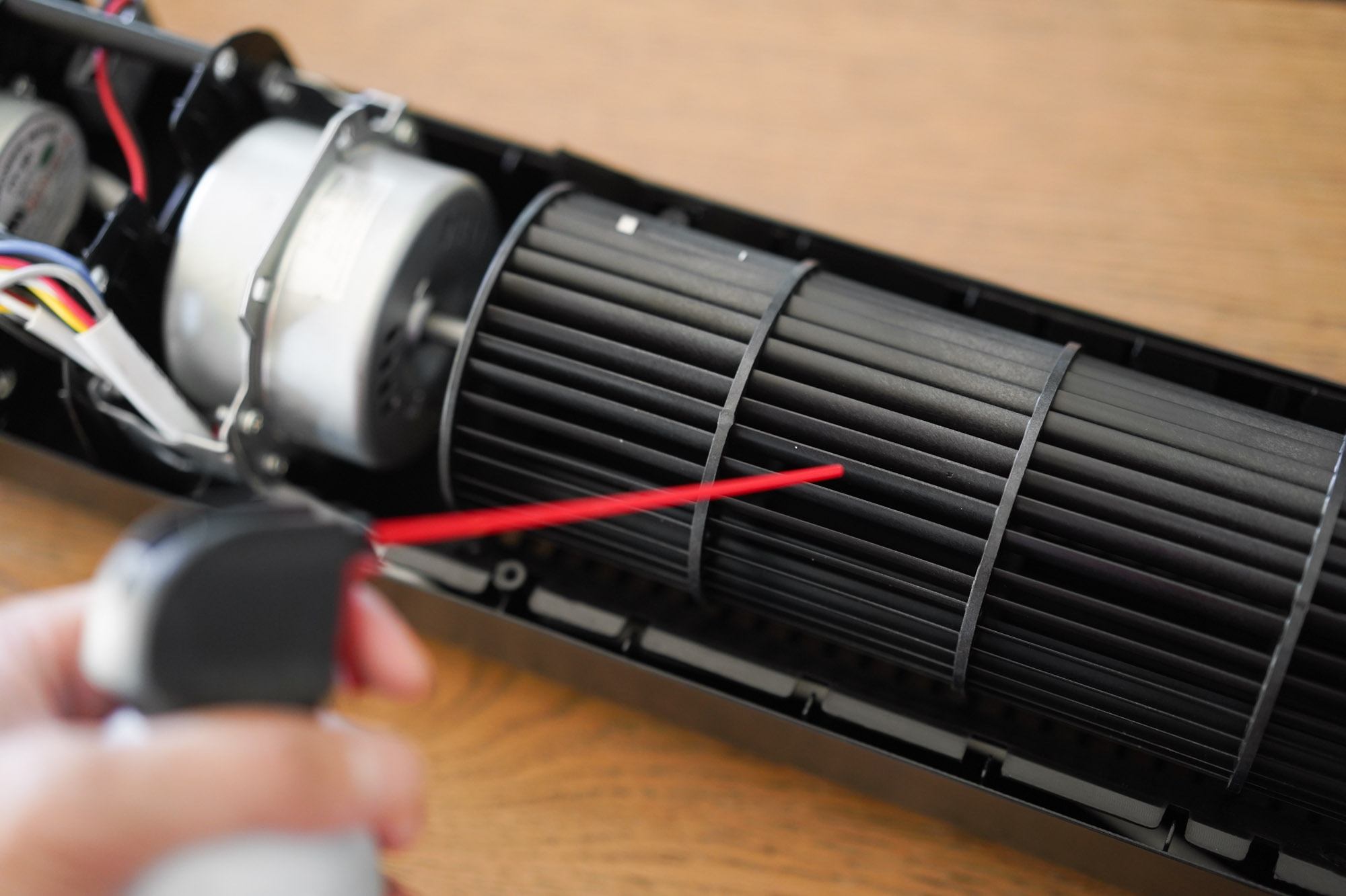 blowing compressed air onto fan blades